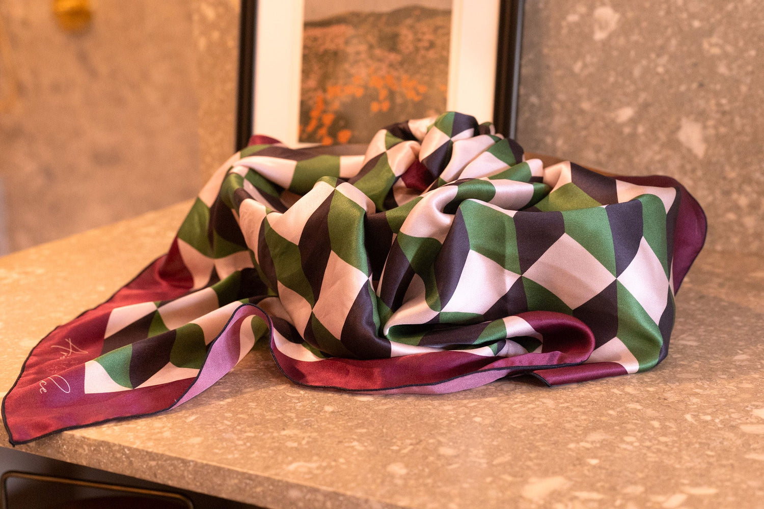 geometric scarf draped across a display counter