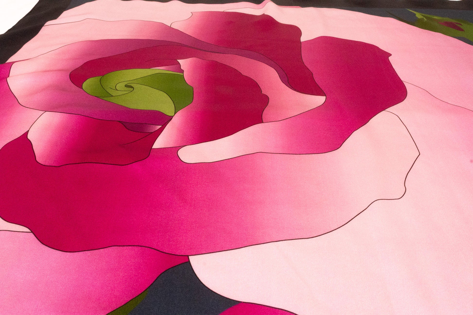 Close-up detail of botanical floral print on luxury silk scarf