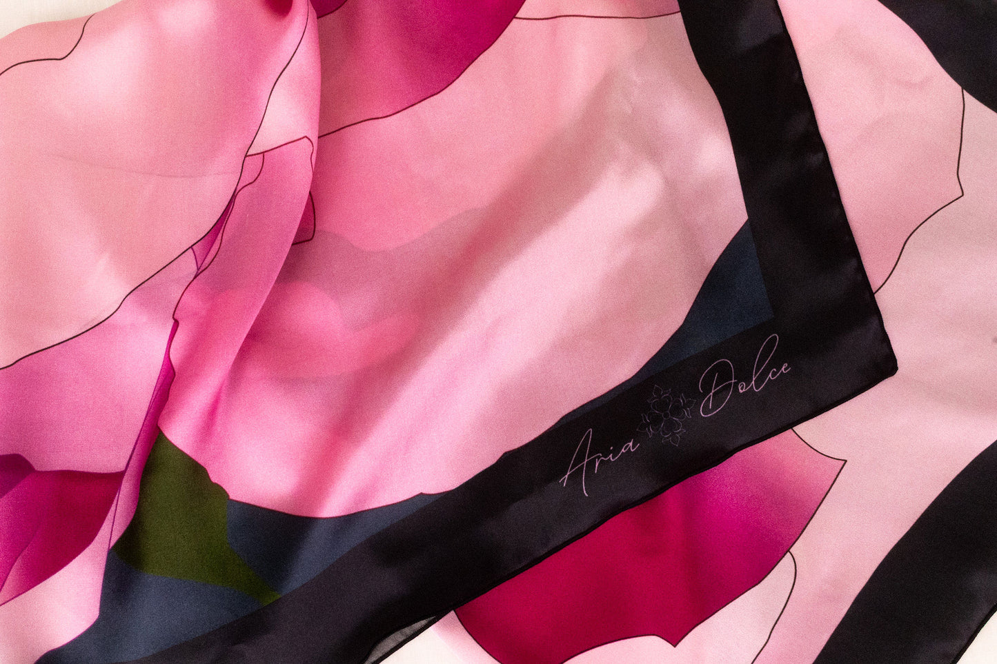 Silk charmeuse fabric texture detail with hand-rolled hem