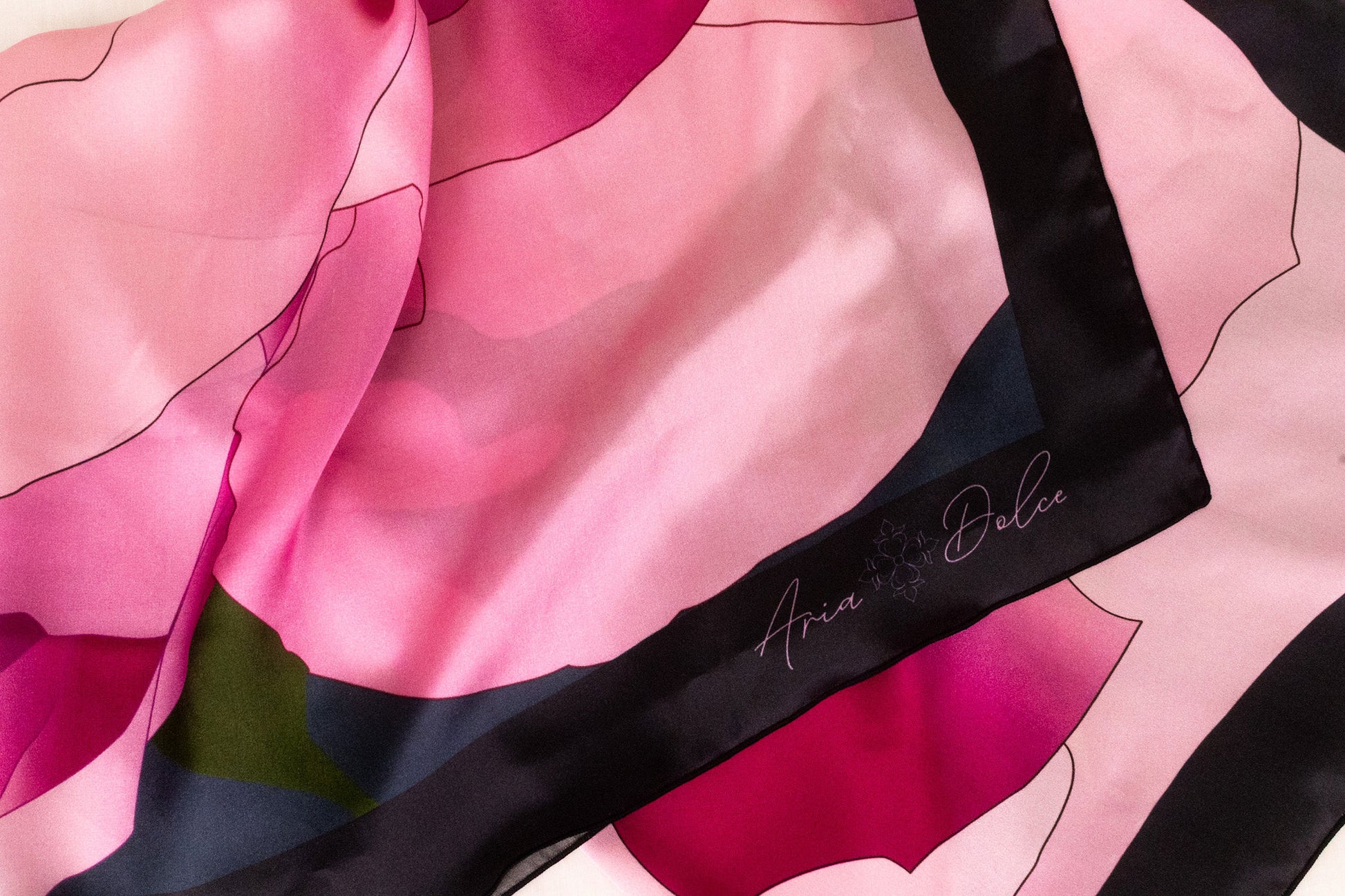Silk charmeuse fabric texture detail with hand-rolled hem