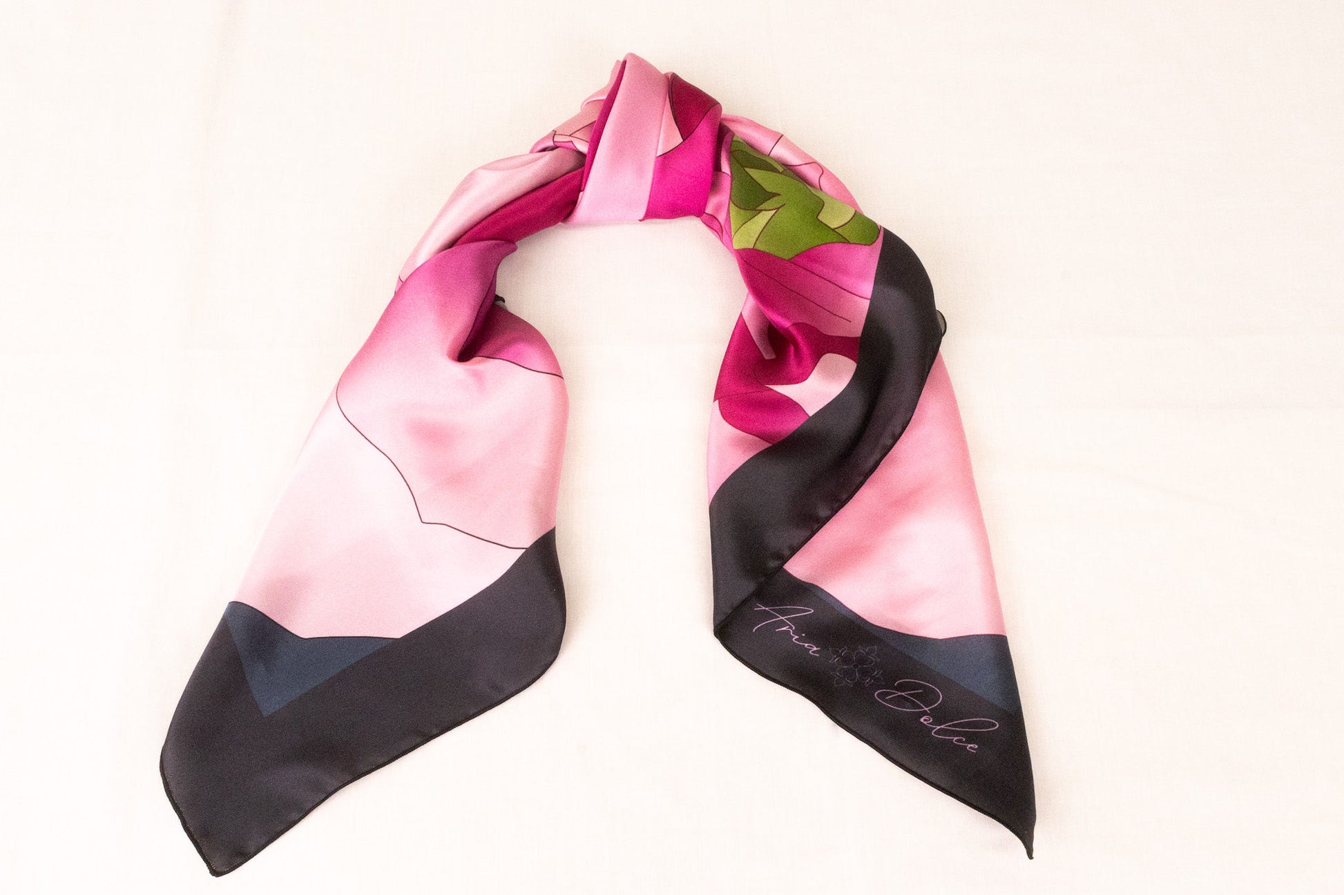Pink silk scarf styled as handbag accessory accent piece
