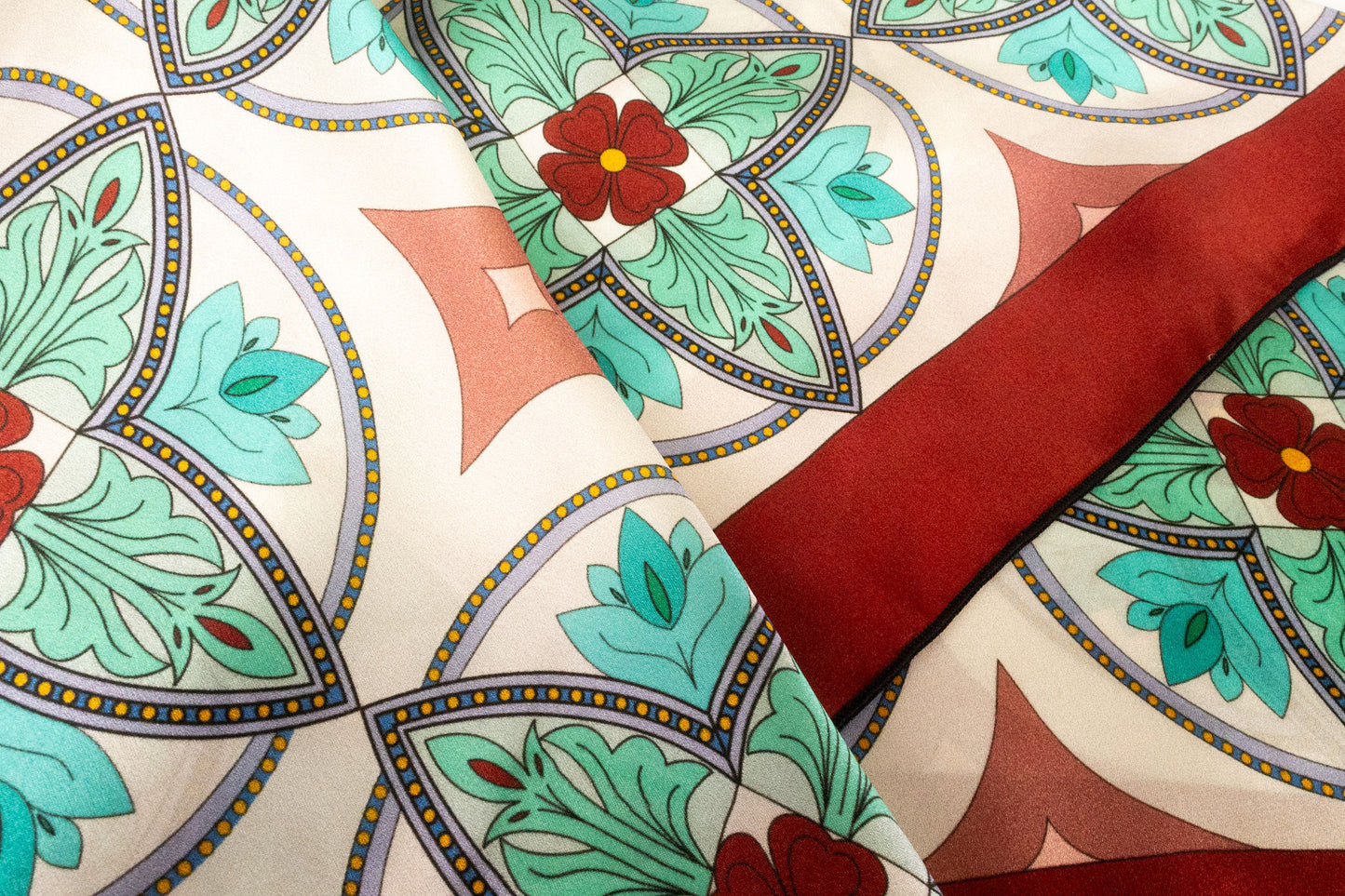 Close-up detail of tile pattern mosaic design on luxury silk scarf