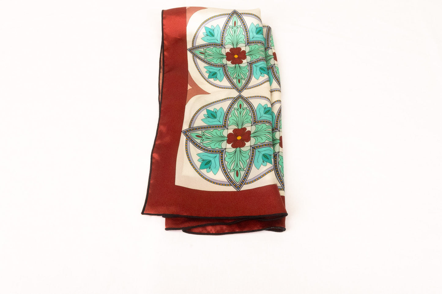 Geometric turquoise silk scarf folded display showing stained glass pattern