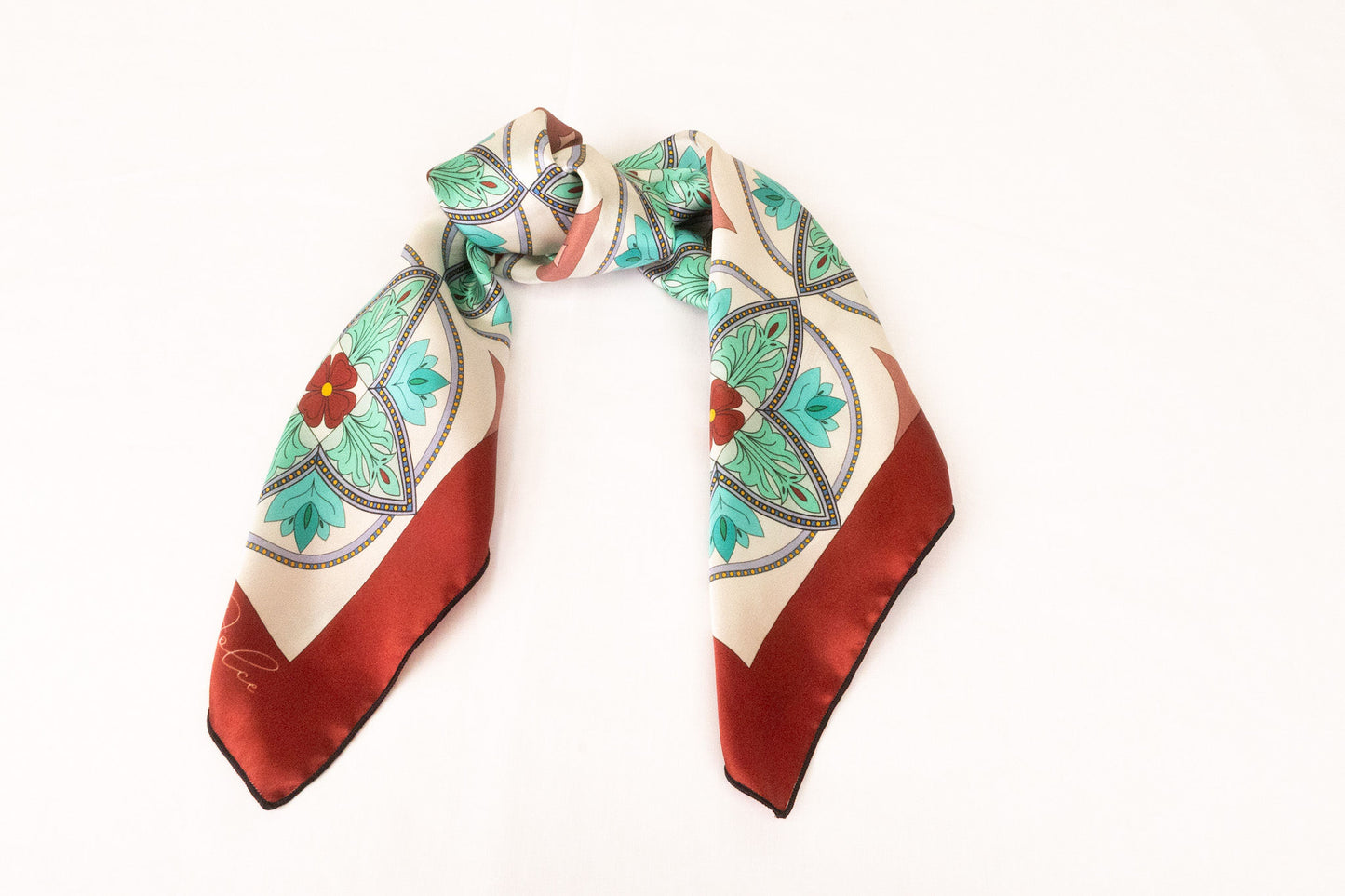 Turquoise silk scarf styled as handbag accessory accent piece