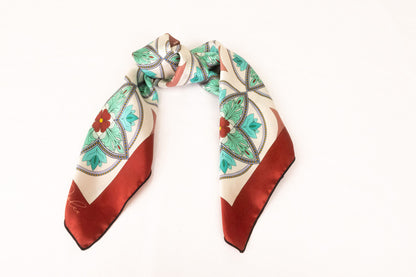 Turquoise silk scarf styled as handbag accessory accent piece